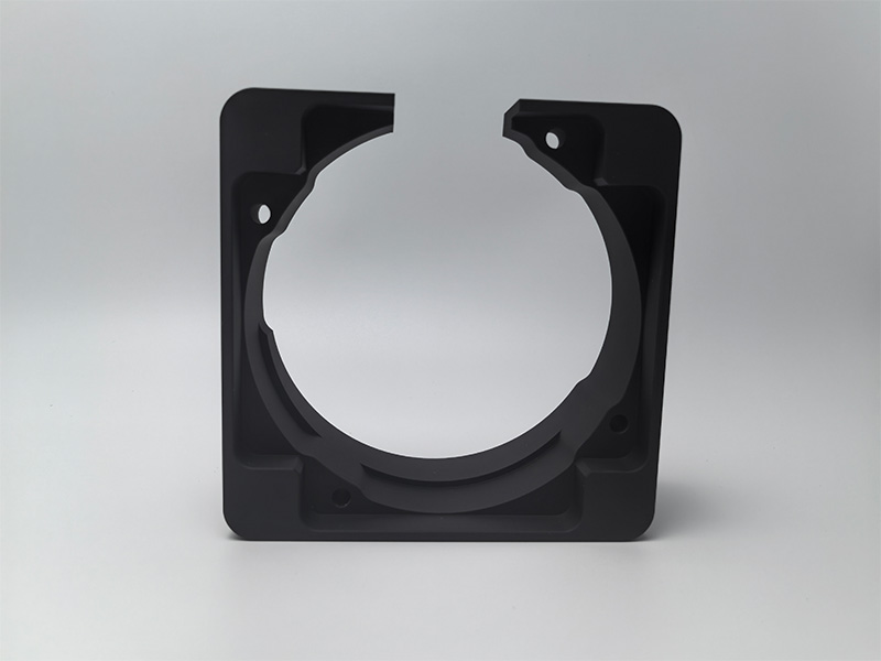 Machined aluminum mounting component with a uniform matte black anodized appearance