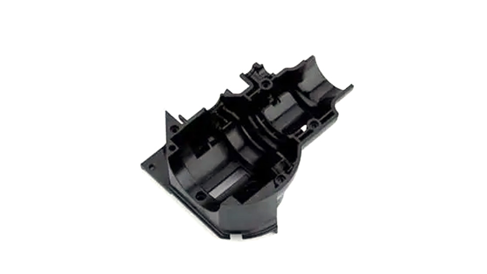 Black machined POM housing with support ribs and internal locating features