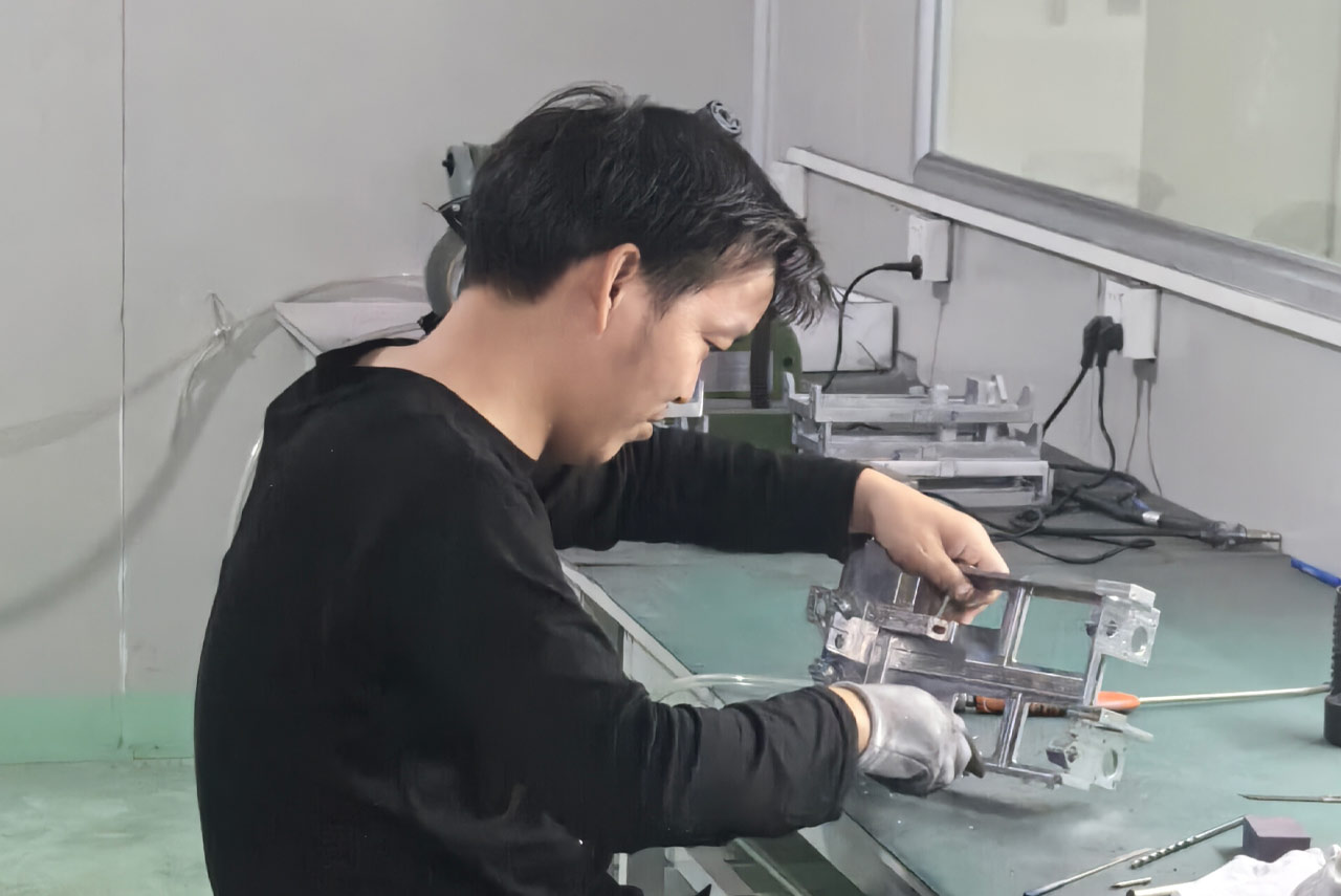 Quality inspector measuring a precision component