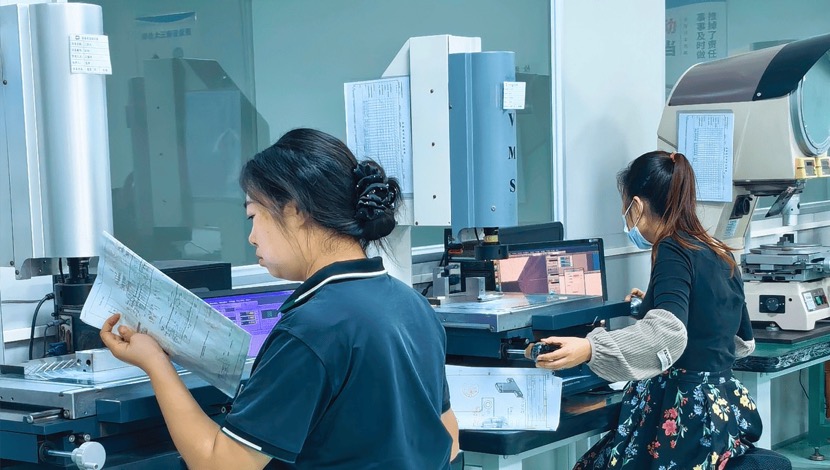 Plyconn colleagues reviewing a manufacturing project